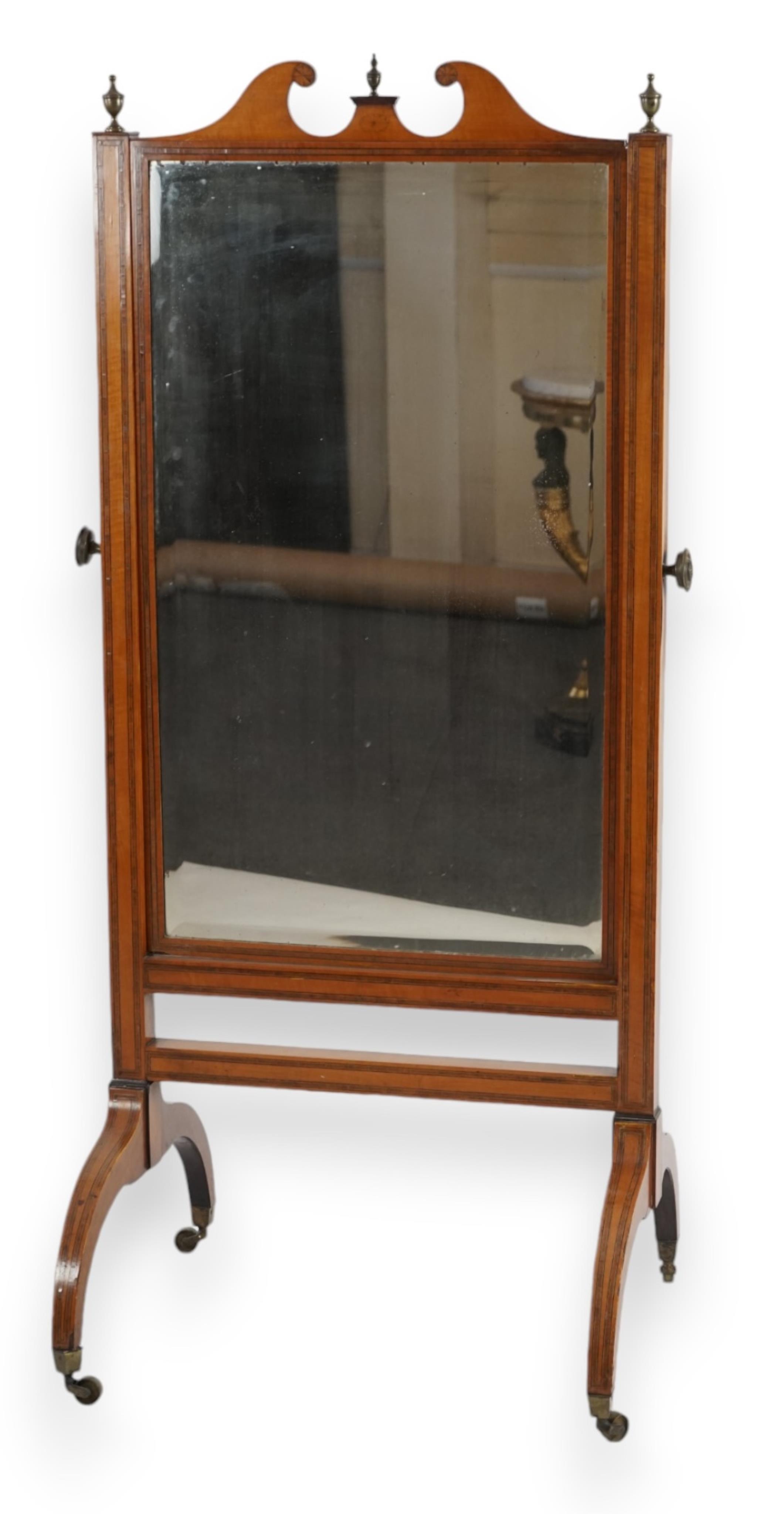 An Edwardian satinwood cheval mirror